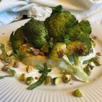 Roasted broccoli and celery root over yogurt with pistachios and basil