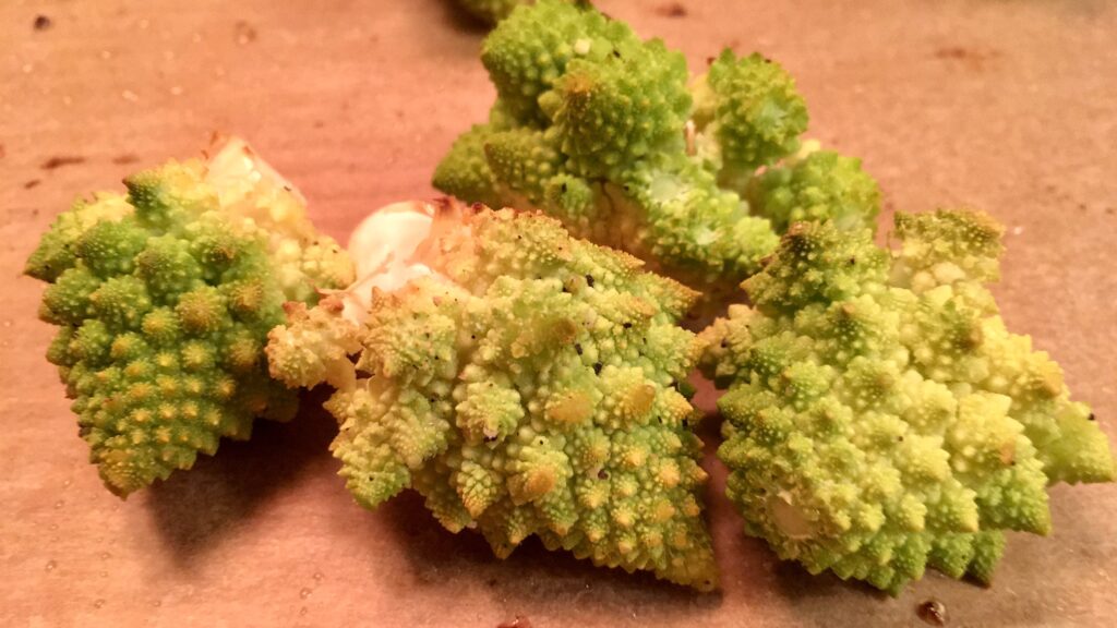 roasted Romanseco florets on parchment paper