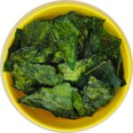 yellow bowl of kohlrabi chips (roasted kohlrabi leaves)