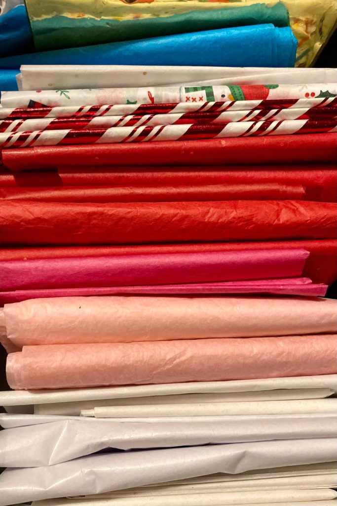 stack of folded tissue paper in various colors and pattersn