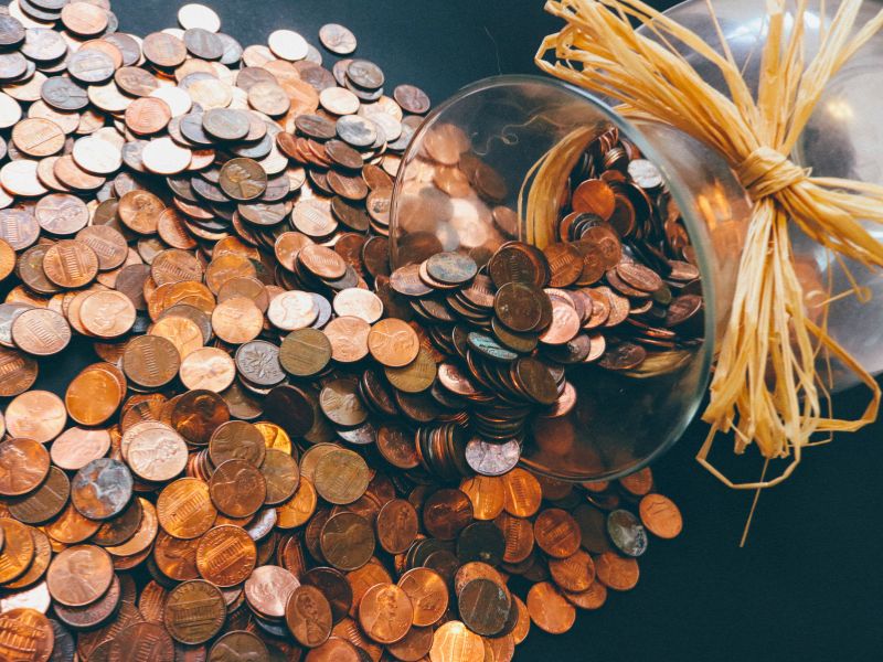 pennies spilling out of jar